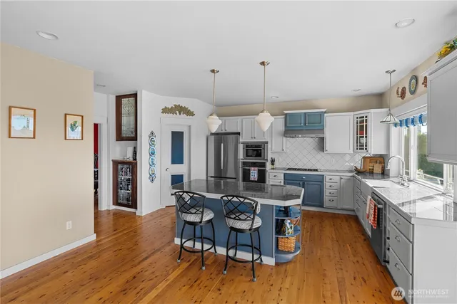 a view of a dining room with furniture and wooden floor