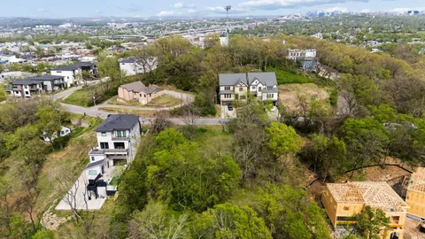 an aerial view of a city with lots of residential buildings