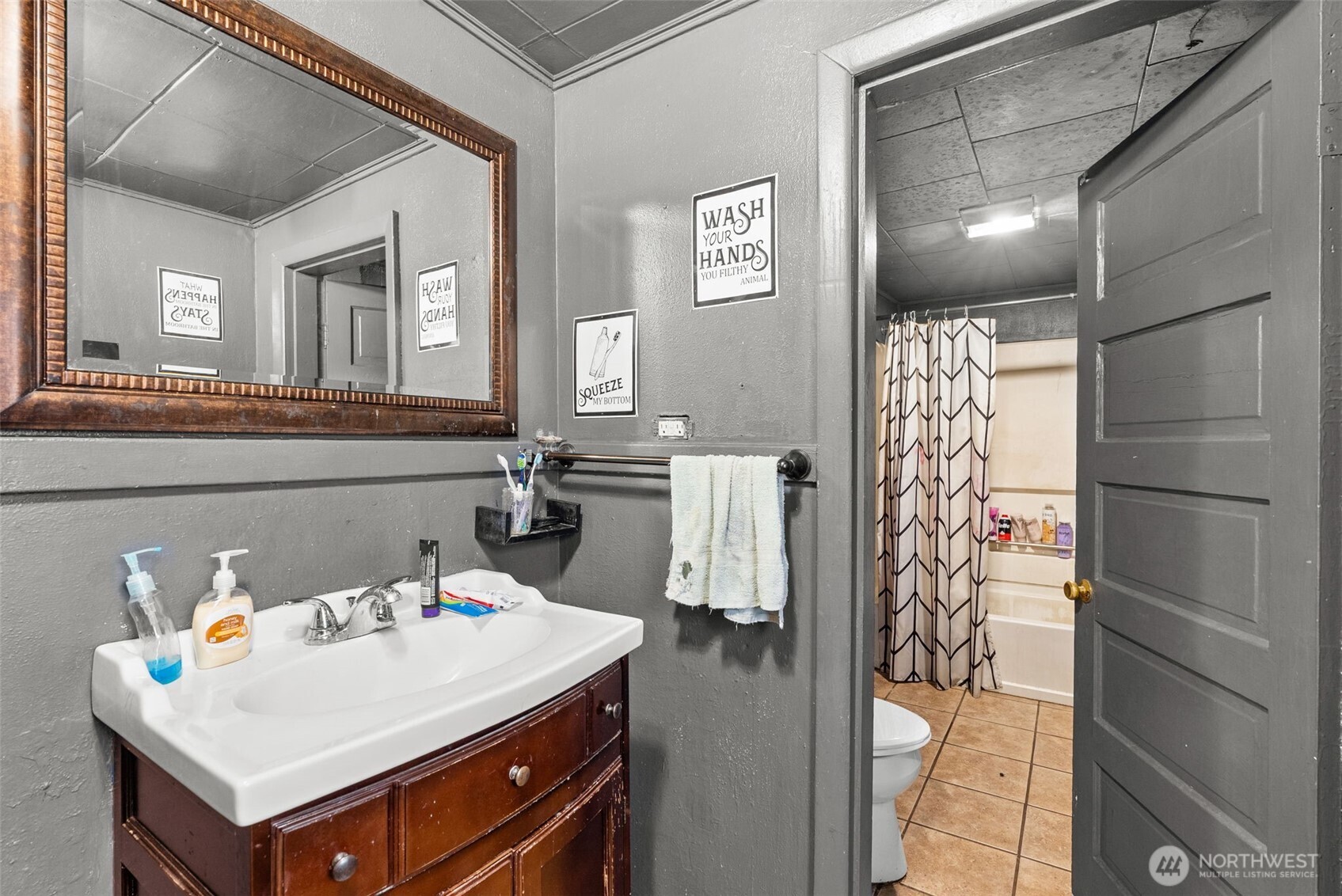 1024 H Street Centralia, WA 98531 - Photo 12 of 16 a bathroom with a sink and a mirror