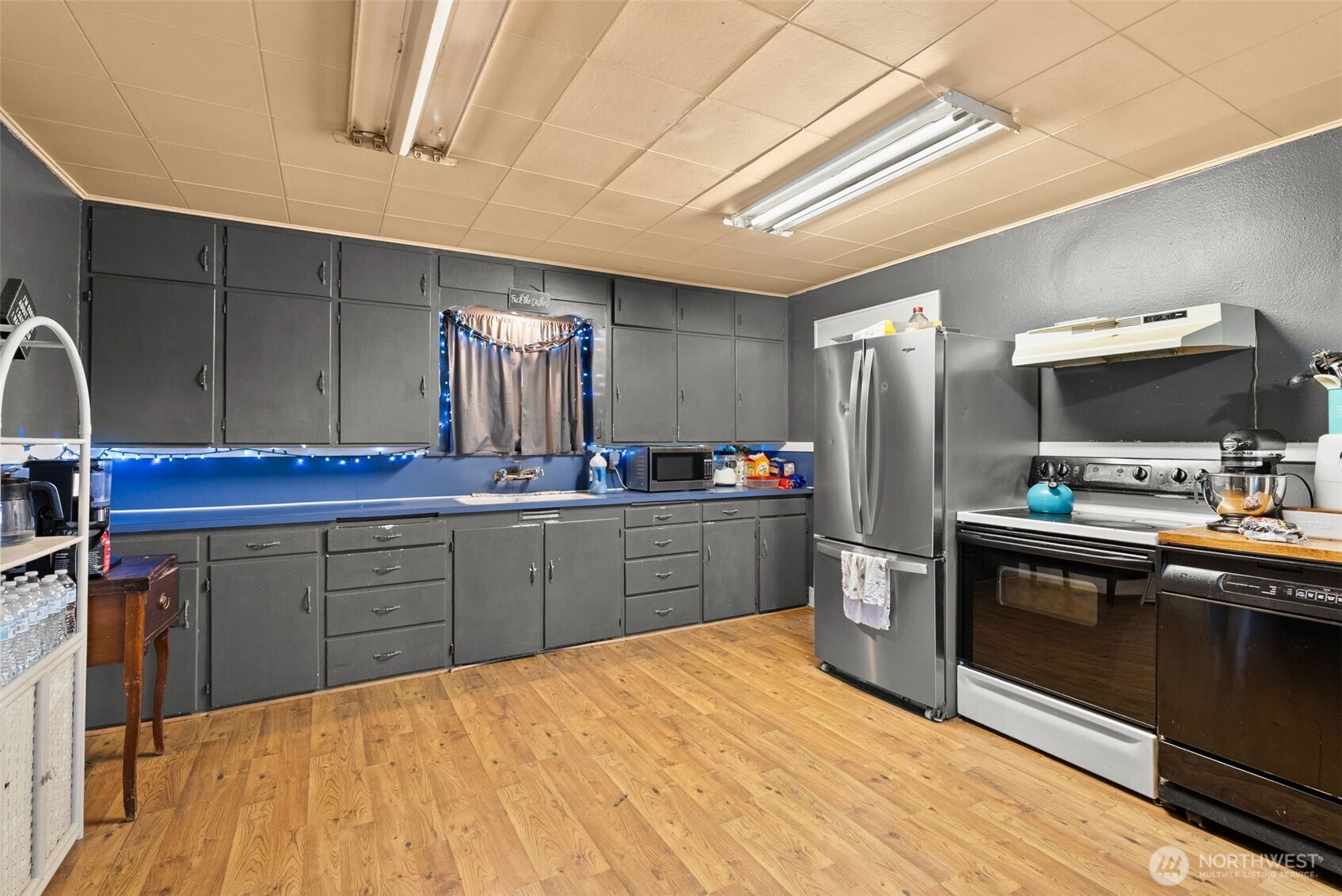 1024 H Street Centralia, WA 98531 - Photo 8 of 16 a kitchen with a sink appliances and cabinets