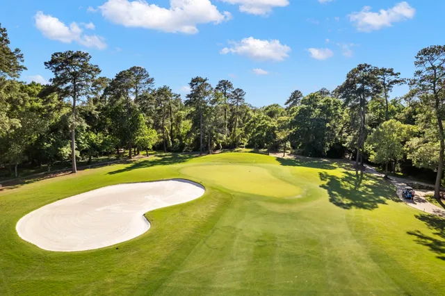 a view of swimming pool with a yard