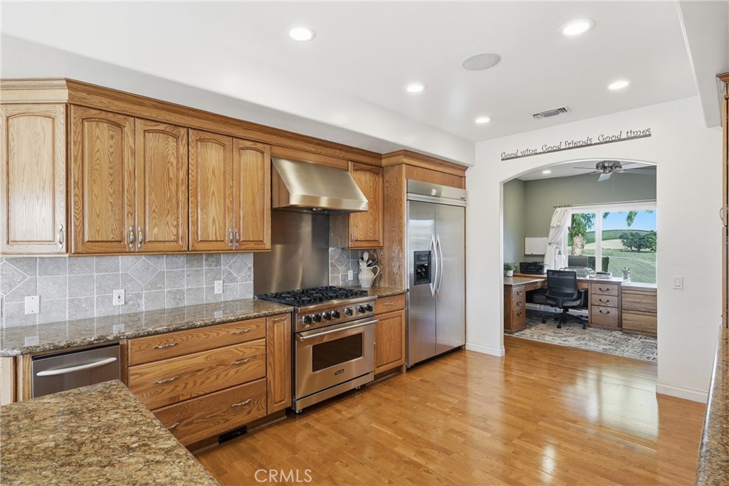 220 Cook Court Templeton, CA 93465 - Photo 13 of 45 a kitchen with stainless steel appliances granite countertop a stove and a refrigerator