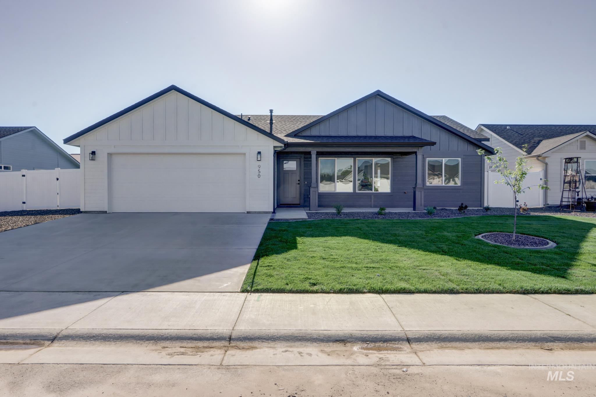 950 Campbell Street Vale, OR 97918 - Photo 2 of 39 Contemporary ranch-style residence featuring a two-tone facade, attached two-car garage, and a covered front porch
