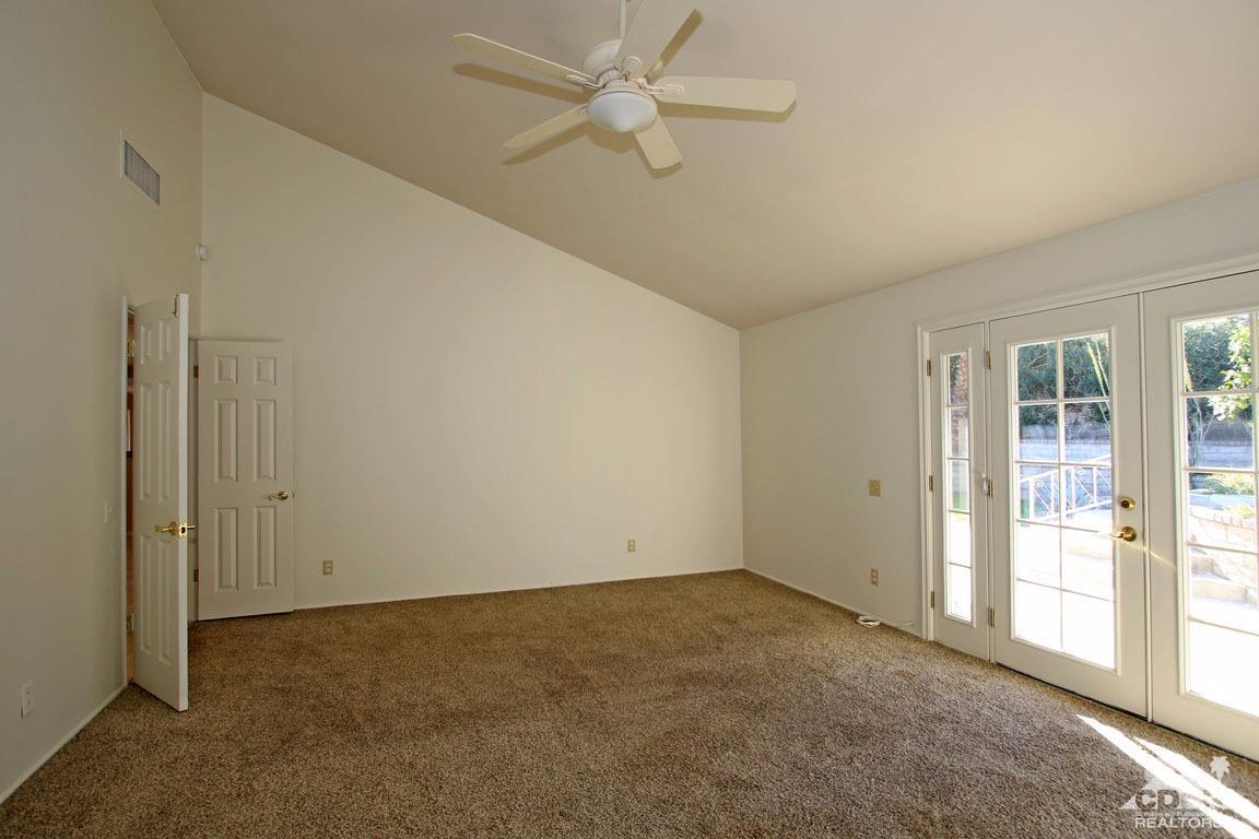 72957 Haystack Road Palm Desert, CA 92260 - Photo 33 of 38 a view of an empty room with a window