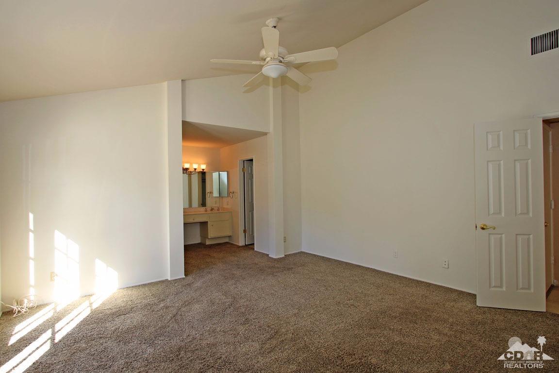 72957 Haystack Road Palm Desert, CA 92260 - Photo 35 of 38 a view of a room with a ceiling fan and closet area