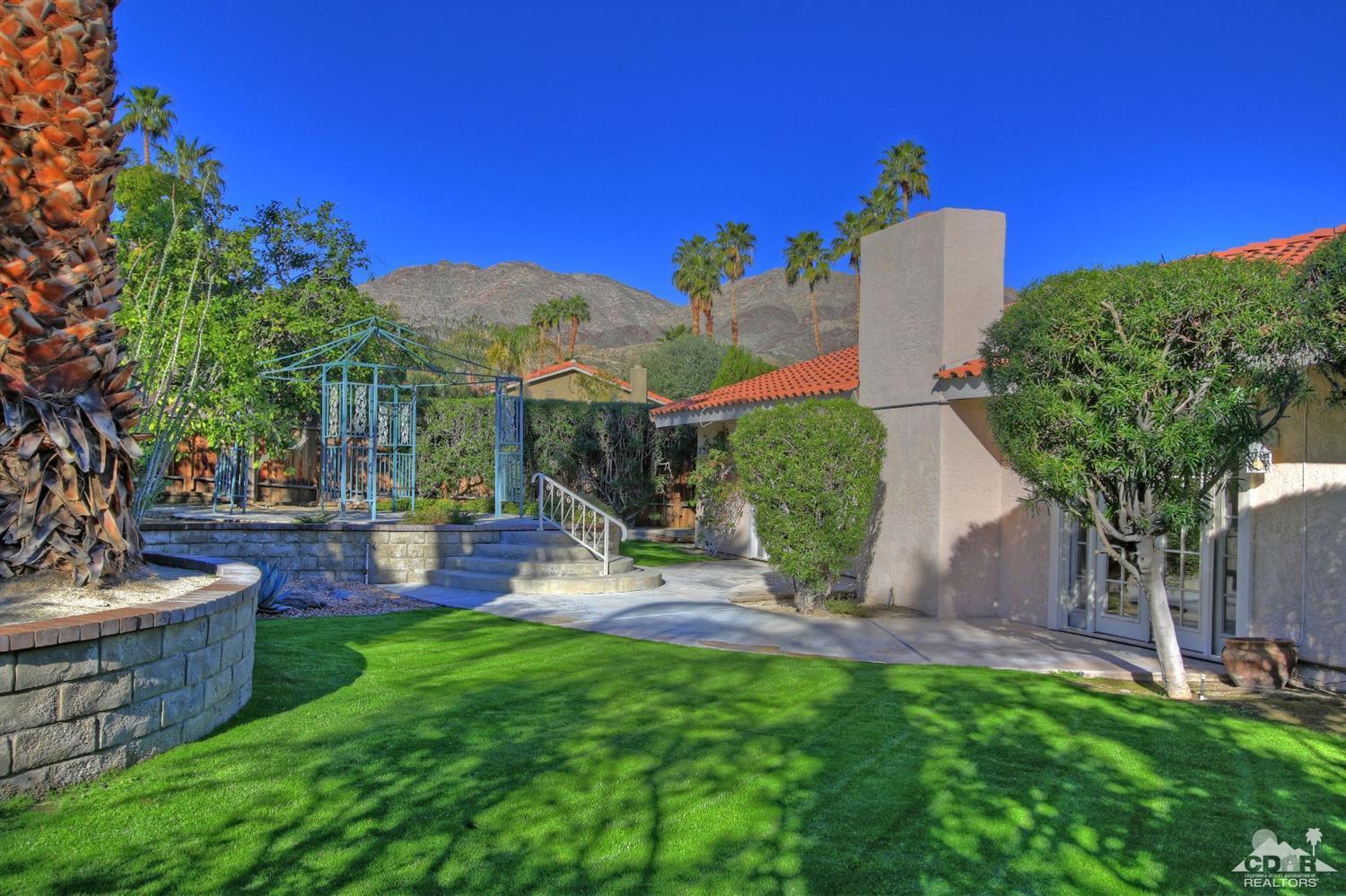 72957 Haystack Road Palm Desert, CA 92260 - Photo 4 of 38 a view of a backyard with plants and outdoor seating