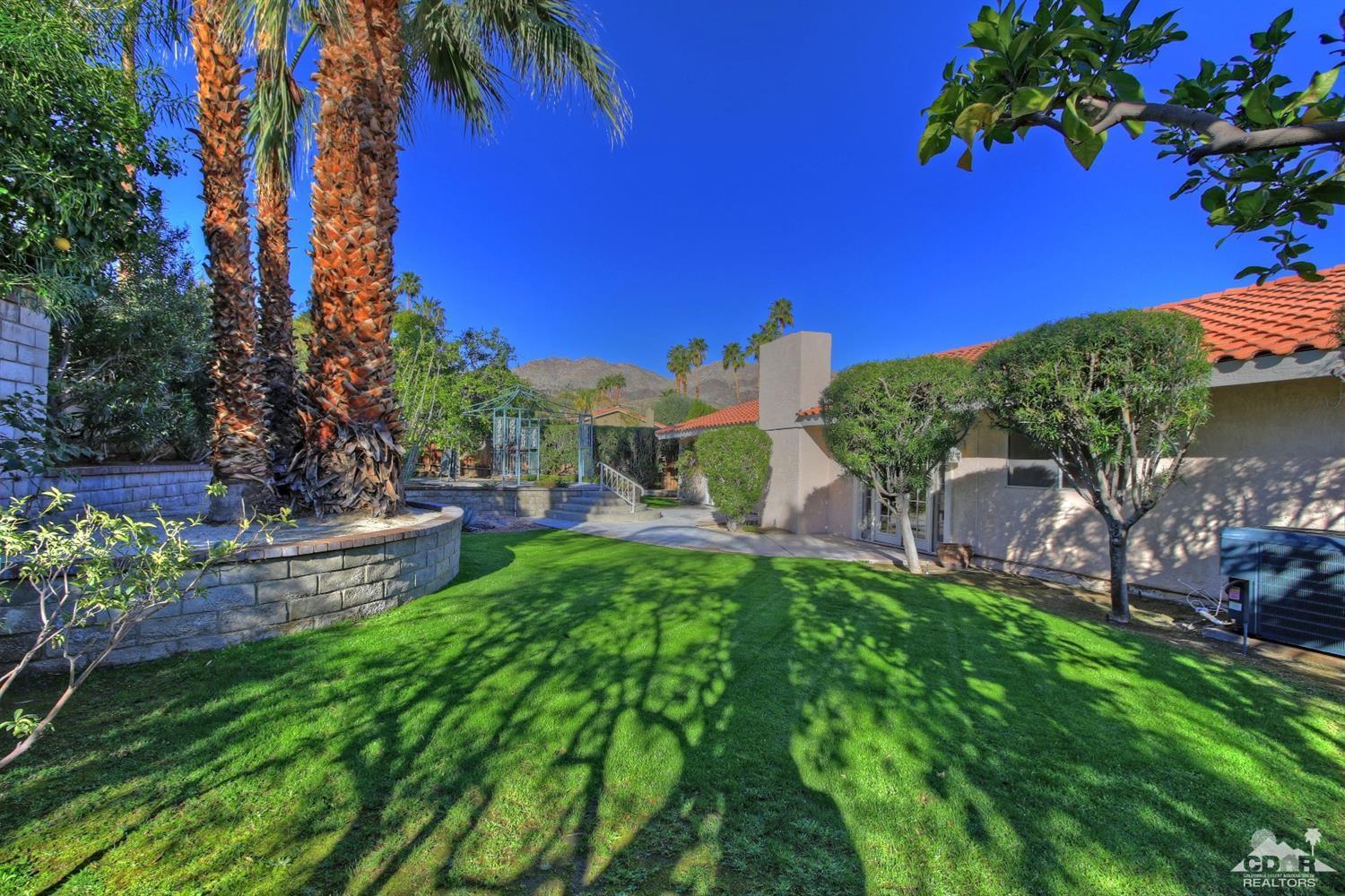 72957 Haystack Road Palm Desert, CA 92260 - Photo 5 of 38 a view of a backyard with a garden