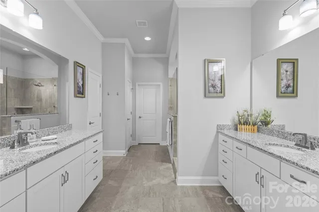 a spacious bathroom with a granite countertop sink mirror and a