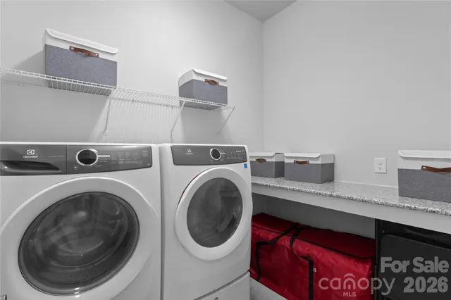 a utility room with dryer and washer