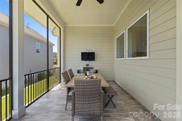 a balcony view with a seating space