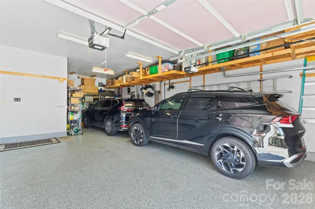 a view of a garage with parked cars