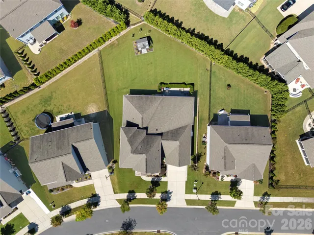 an aerial view of houses with yard