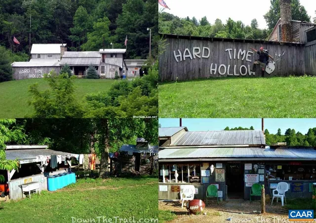 a sign that is sitting in front of a tree