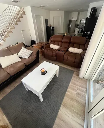 a living room with furniture and a couch