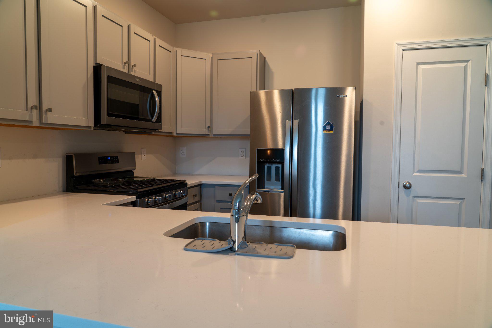57 Arlotta Street Glassboro, NJ 08028 - Photo 3 of 17 a kitchen with stainless steel appliances granite countertop a refrigerator and a stove top oven