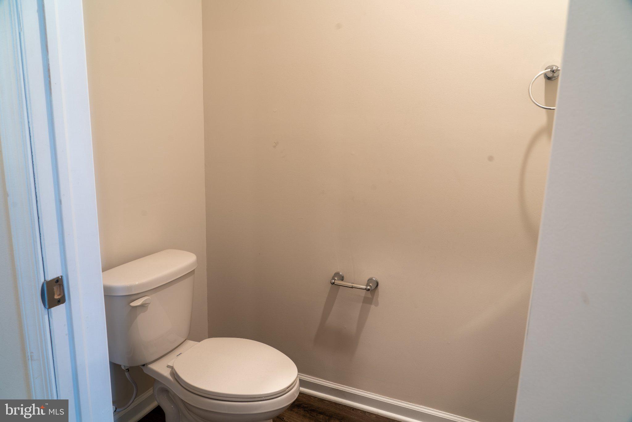 57 Arlotta Street Glassboro, NJ 08028 - Photo 5 of 17 a white toilet sitting next to a shower