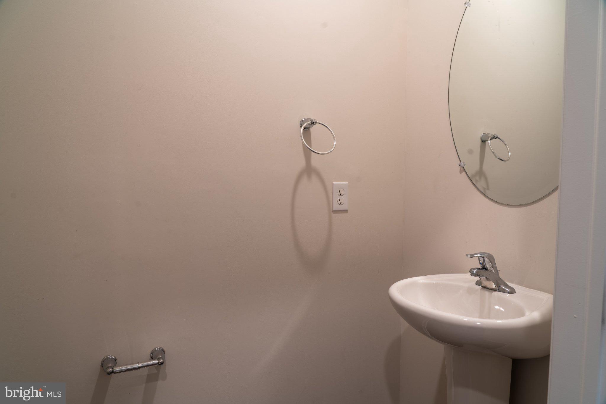 57 Arlotta Street Glassboro, NJ 08028 - Photo 6 of 17 a bathroom with a sink and mirror