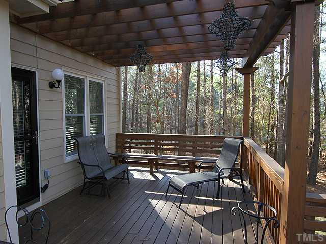12025 Pembridge Lane Raleigh, NC 27613 - Photo 20 of 24 The deck is huge and bi-level, part is covered with a trellis and the other is completely open Patio/Deck