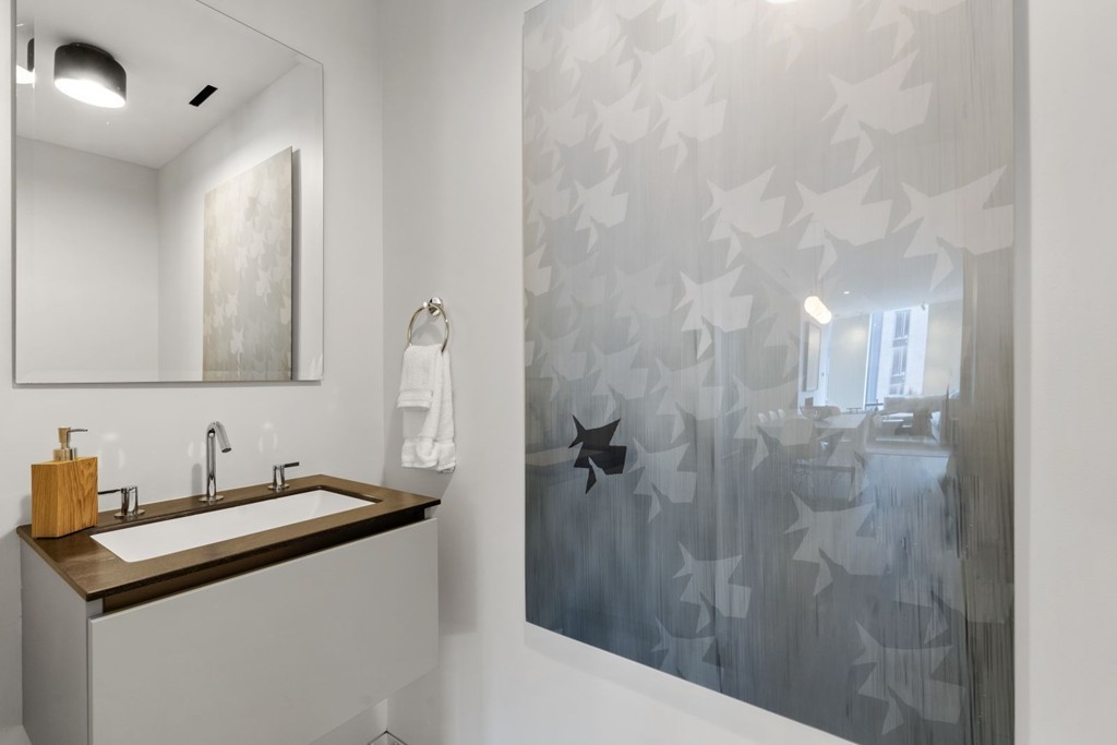 10 Farnsworth Street, Unit 5B Boston, MA 02210 - Photo 13 of 35 a bathroom with a sink and mirror