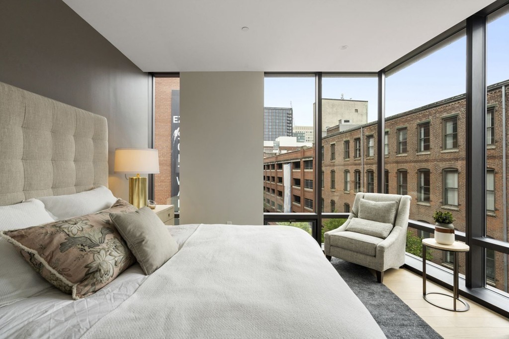 10 Farnsworth Street, Unit 5B Boston, MA 02210 - Photo 15 of 35 a bedroom with a bed and glass window