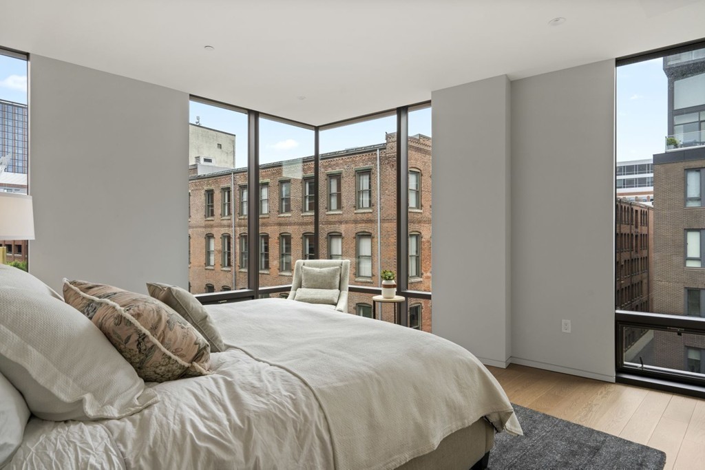10 Farnsworth Street, Unit 5B Boston, MA 02210 - Photo 17 of 35 a bedroom with a bed next to a window