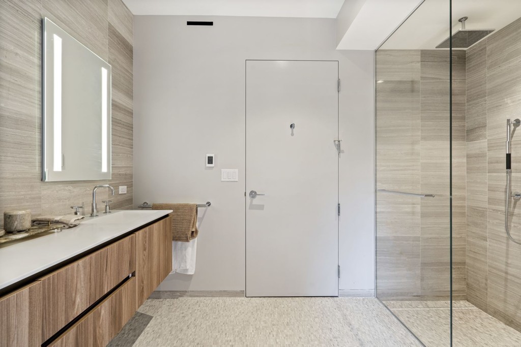 10 Farnsworth Street, Unit 5B Boston, MA 02210 - Photo 18 of 35 a bathroom with a sink and a mirror
