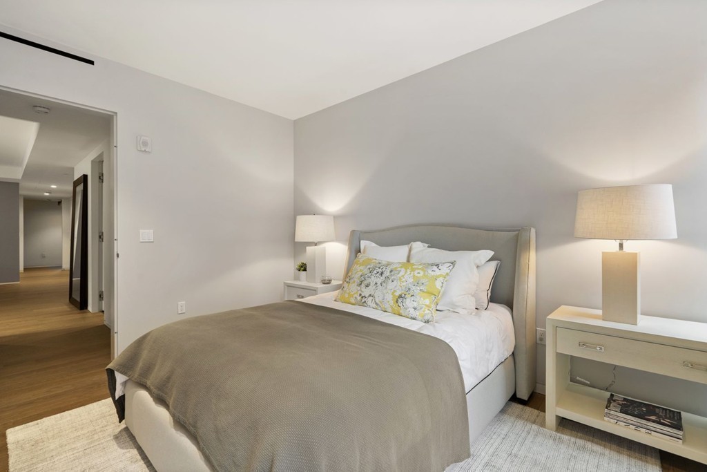 10 Farnsworth Street, Unit 5B Boston, MA 02210 - Photo 22 of 35 a bedroom with a bed and a couch