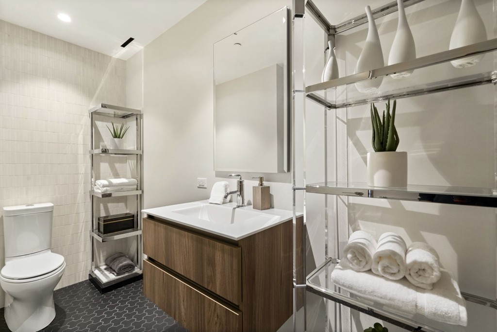 10 Farnsworth Street, Unit 5B Boston, MA 02210 - Photo 23 of 35 a bathroom with a sink vanity mirror and toilet