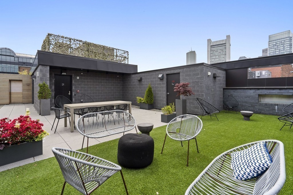 10 Farnsworth Street, Unit 5B Boston, MA 02210 - Photo 30 of 35 a view of a chair and tables in the patio