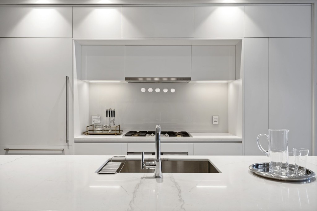 10 Farnsworth Street, Unit 5B Boston, MA 02210 - Photo 5 of 35 a kitchen with a sink and a stove