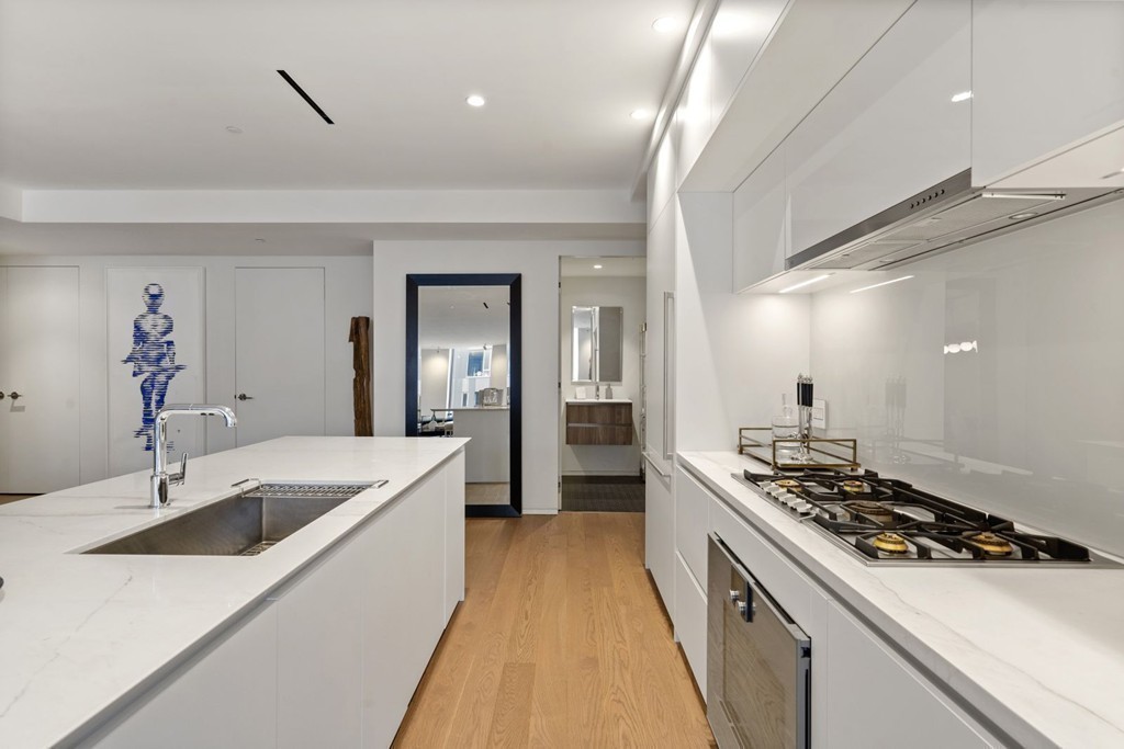10 Farnsworth Street, Unit 5B Boston, MA 02210 - Photo 6 of 35 a kitchen that has a sink and a stove