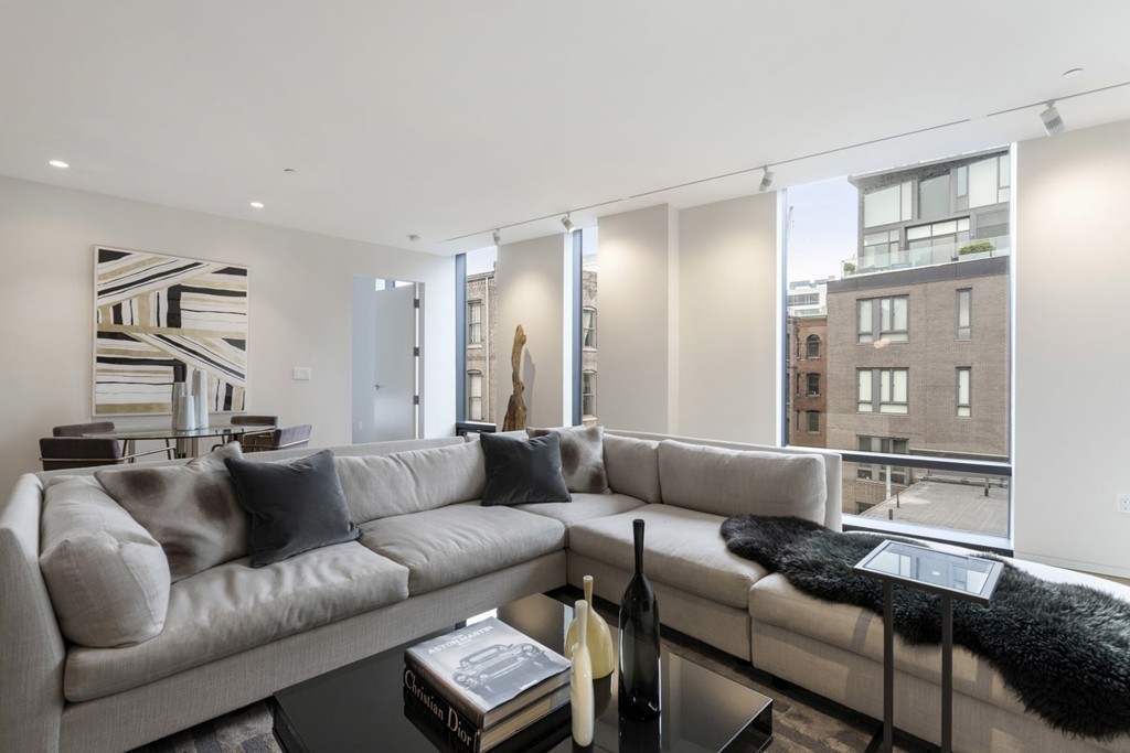 10 Farnsworth Street, Unit 5B Boston, MA 02210 - Photo 9 of 35 a living room with furniture and a couch