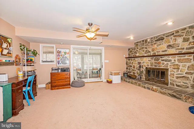 a spacious bedroom with a bed and a chandelier