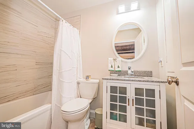 a living room with lots of furniture and a pool table