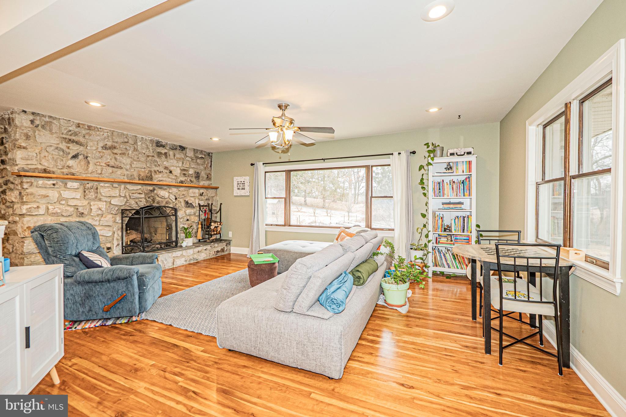 16834 Buck Lantz Road Sabillasville, MD 21780 - Photo 27 of 81 a living room with fireplace furniture and a wooden floor