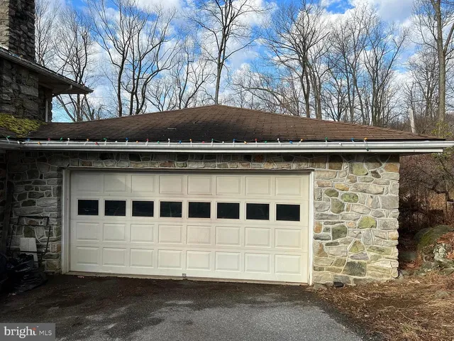 a view of wooden house with a large window