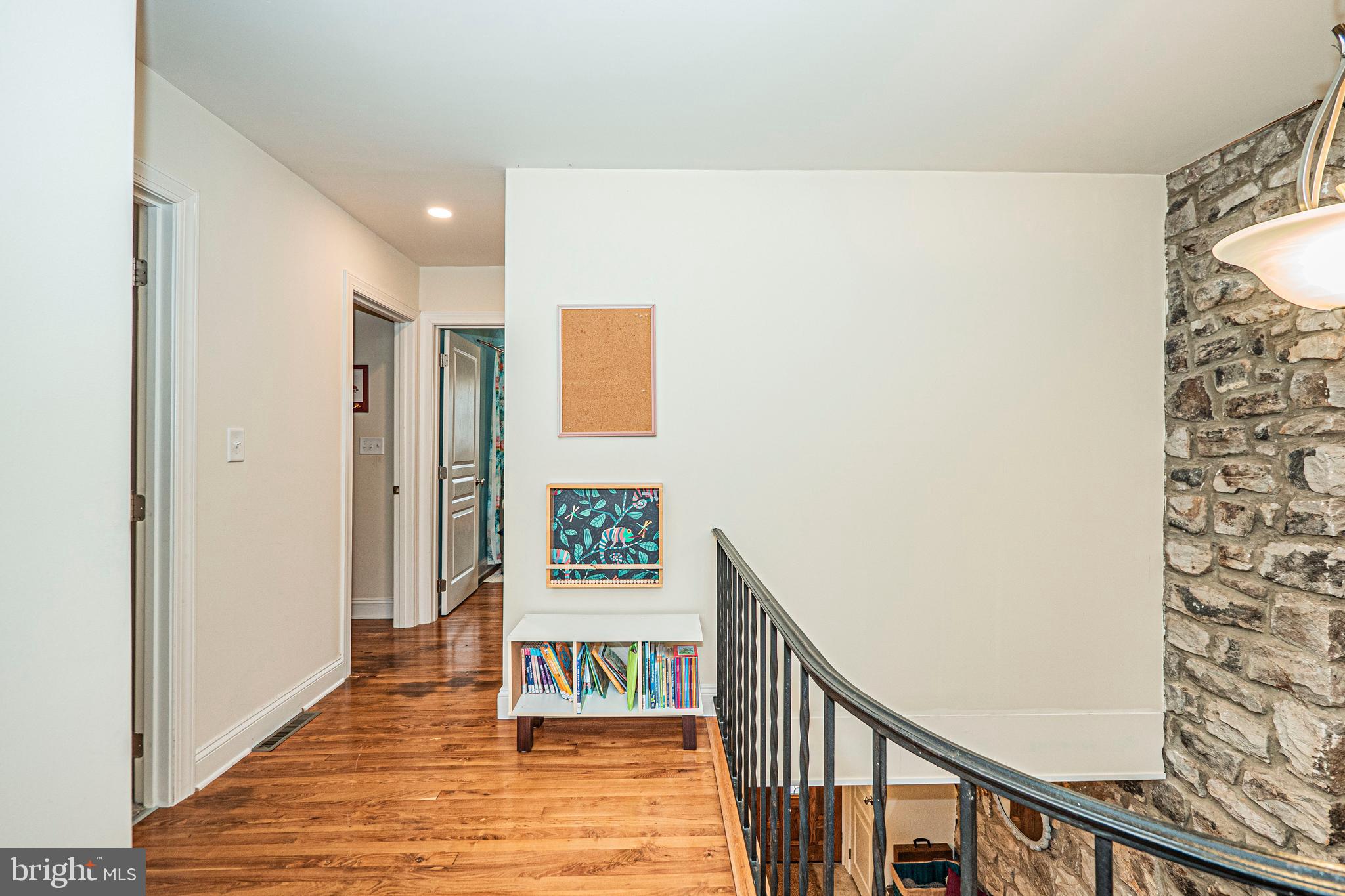 16834 Buck Lantz Road Sabillasville, MD 21780 - Photo 43 of 81 a view of a hallway with wooden floor and staircase