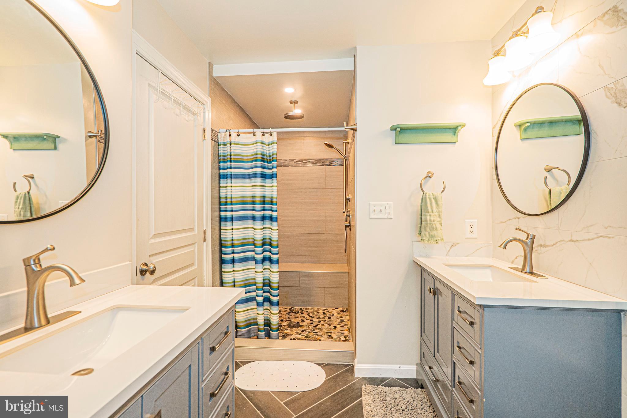 16834 Buck Lantz Road Sabillasville, MD 21780 - Photo 49 of 81 a bathroom with a sink and a mirror