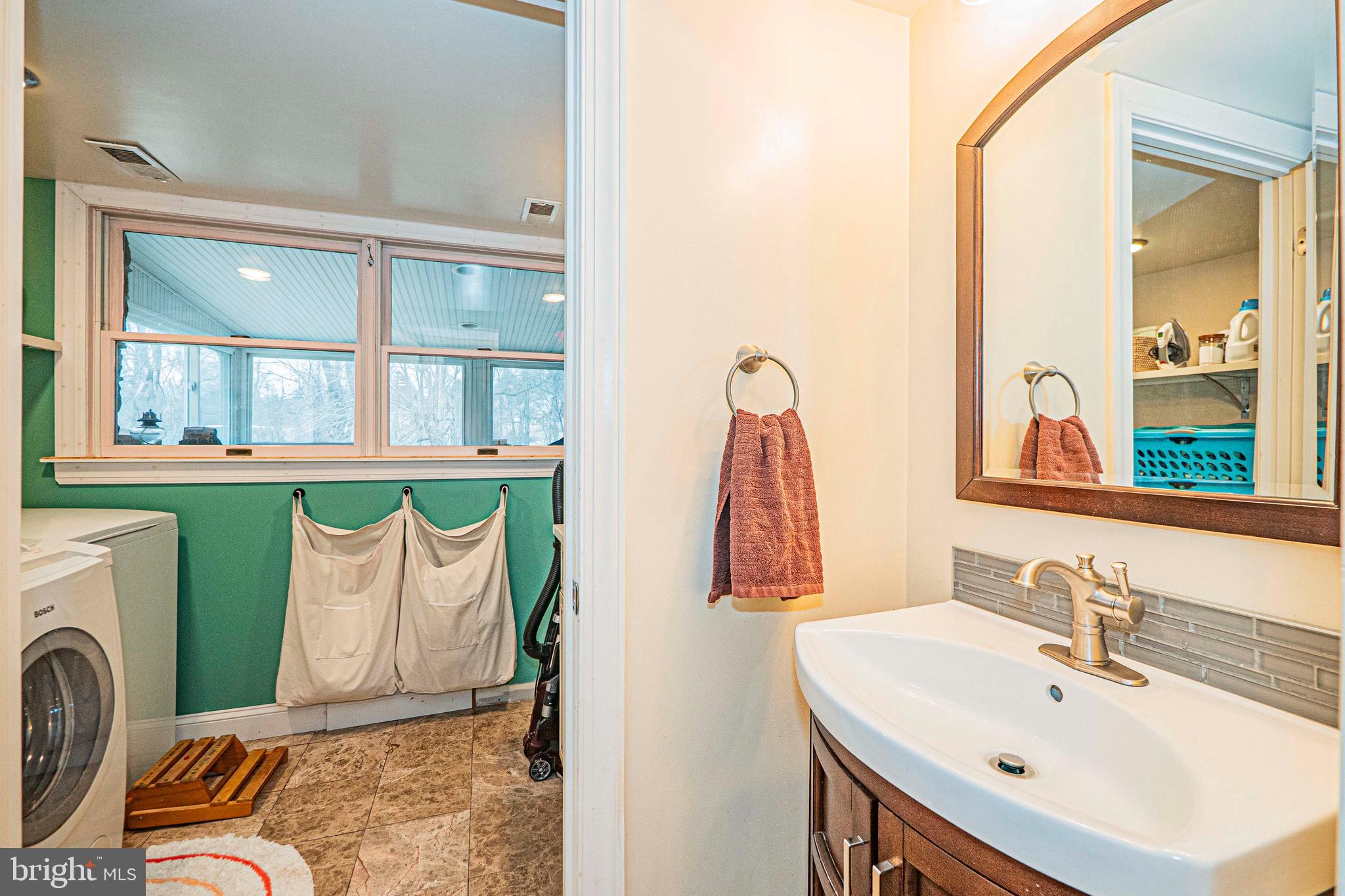 16834 Buck Lantz Road Sabillasville, MD 21780 - Photo 5 of 81 a bathroom with a sink and a mirror