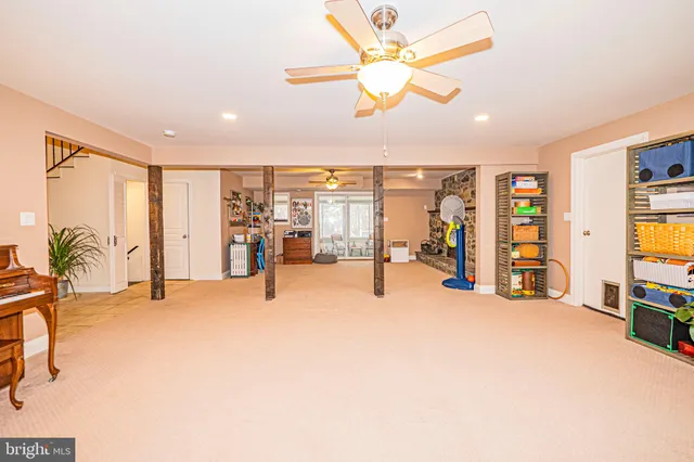 a kitchen with granite countertop white cabinets stainless steel appliances a sink and cabinets