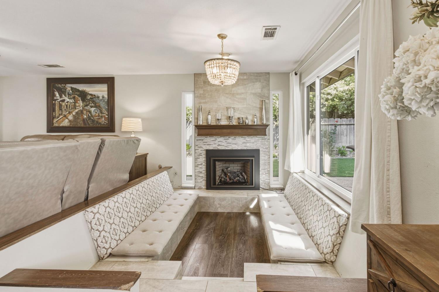 2882 El Camino Real Merced, CA 95340 - Photo 16 of 32 a living room with furniture large window and fireplace