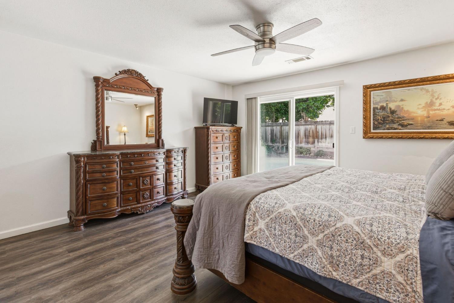 2882 El Camino Real Merced, CA 95340 - Photo 18 of 32 a bedroom with a bed dresser and a large window