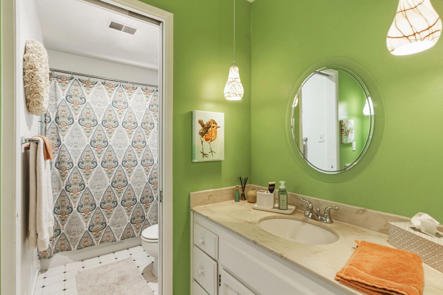 2882 El Camino Real Merced, CA 95340 - Photo 23 of 32 a bathroom with a mirror sink and vanity