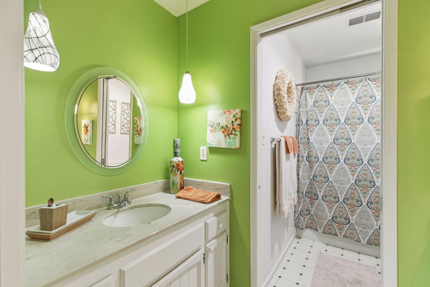 2882 El Camino Real Merced, CA 95340 - Photo 25 of 32 a bathroom with a granite countertop sink a mirror and shower