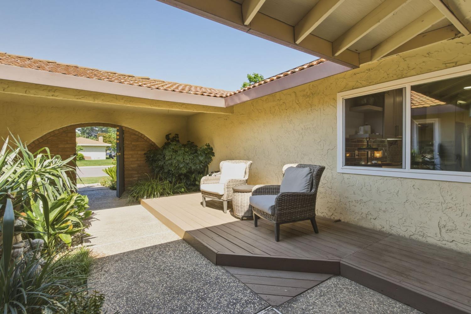 2882 El Camino Real Merced, CA 95340 - Photo 4 of 32 a view of a patio with table and chairs with wooden floor