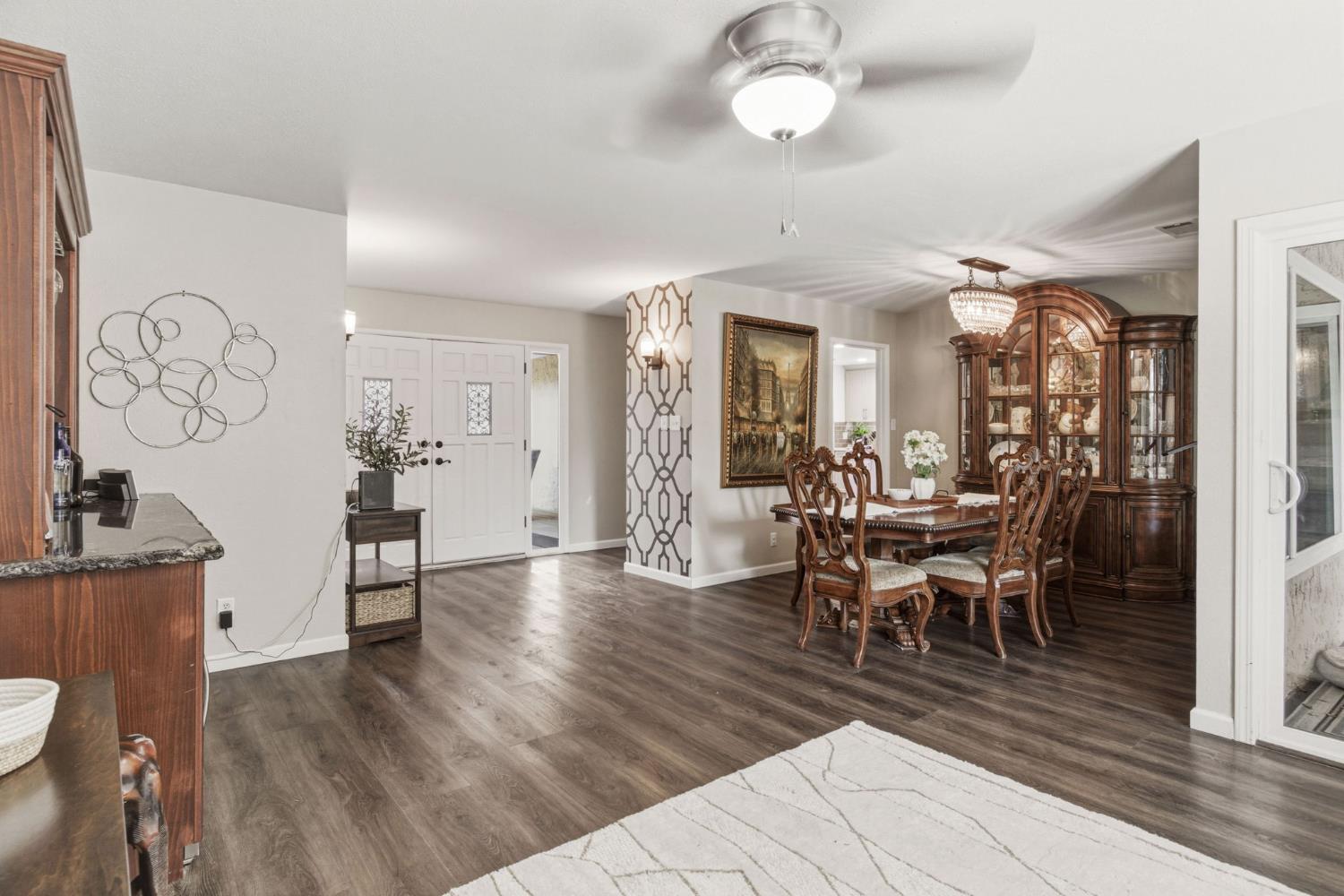 2882 El Camino Real Merced, CA 95340 - Photo 7 of 32 a view of a dining room with furniture and wooden floor
