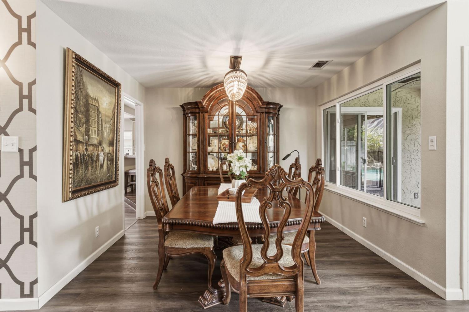 2882 El Camino Real Merced, CA 95340 - Photo 8 of 32 a view of a dining room with furniture window and wooden floor