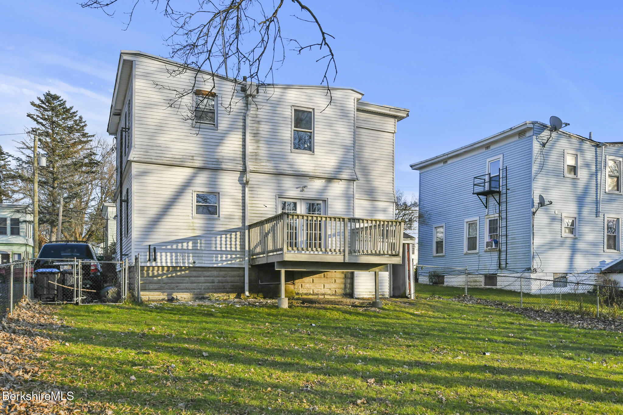 21 Pacific Street Pittsfield, MA 01201 - Photo 5 of 29 a front view of a building with a garden