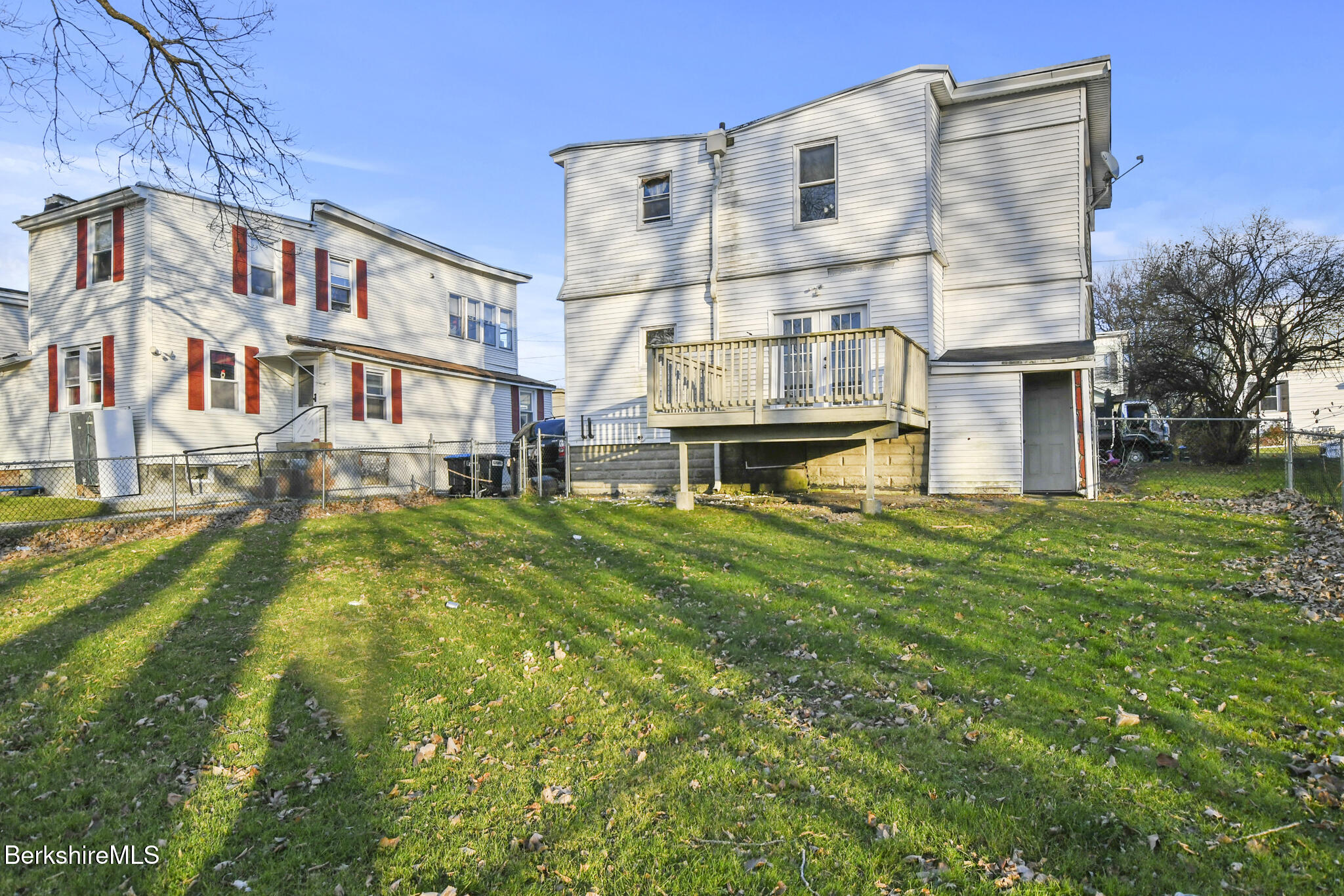 21 Pacific Street Pittsfield, MA 01201 - Photo 6 of 29 a view of a building with a yard