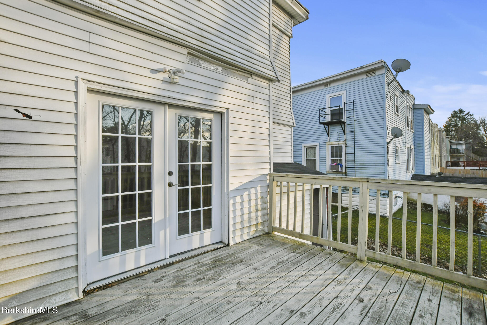 21 Pacific Street Pittsfield, MA 01201 - Photo 10 of 29 a view of a wooden house on a deck